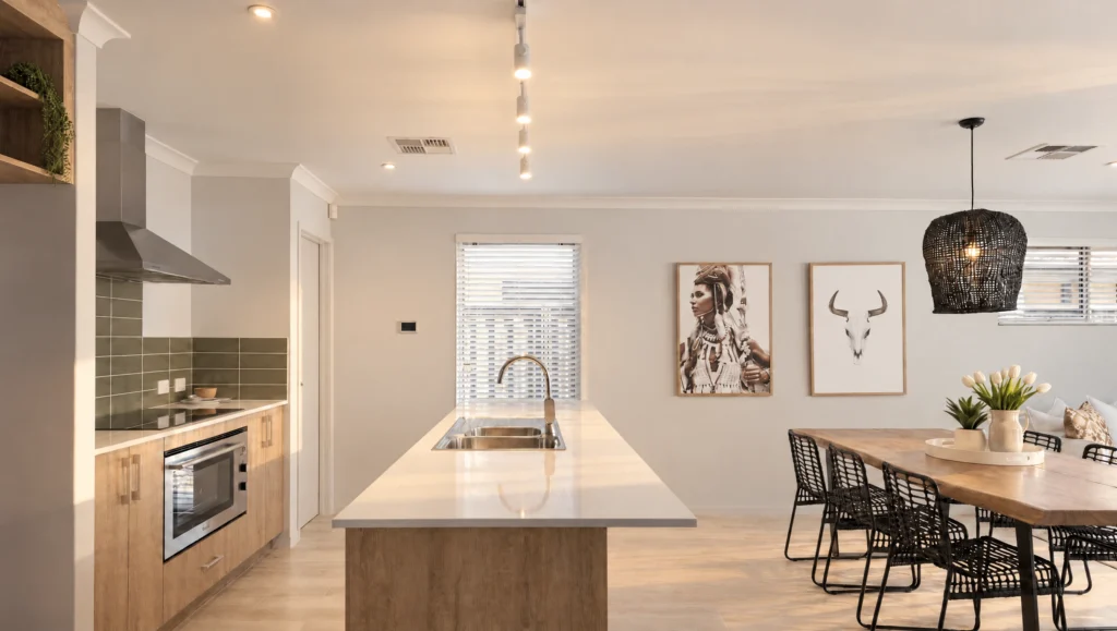 Modern kitchen and dining area with wooden cabinets, a large island, and artwork on the wall.