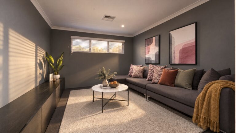 A modern living room with a sectional sofa, coffee table, and entertainment unit, featuring abstract art and warm lighting.