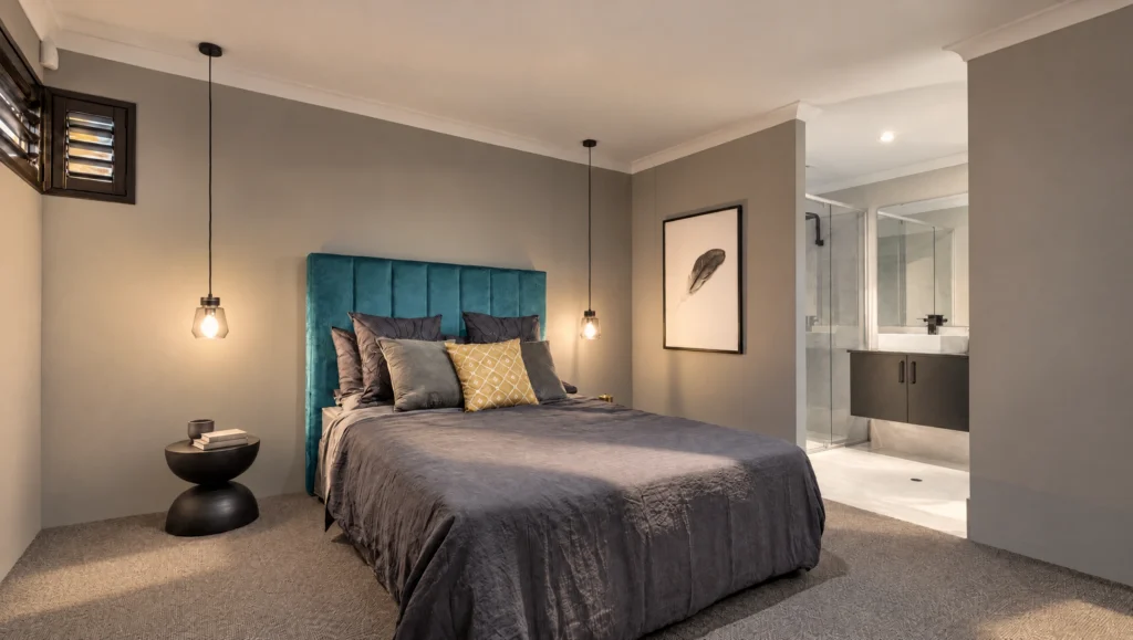 The Wedge Island bedroom features a queen-size bed with a teal headboard and a modern ensuite bathroom.