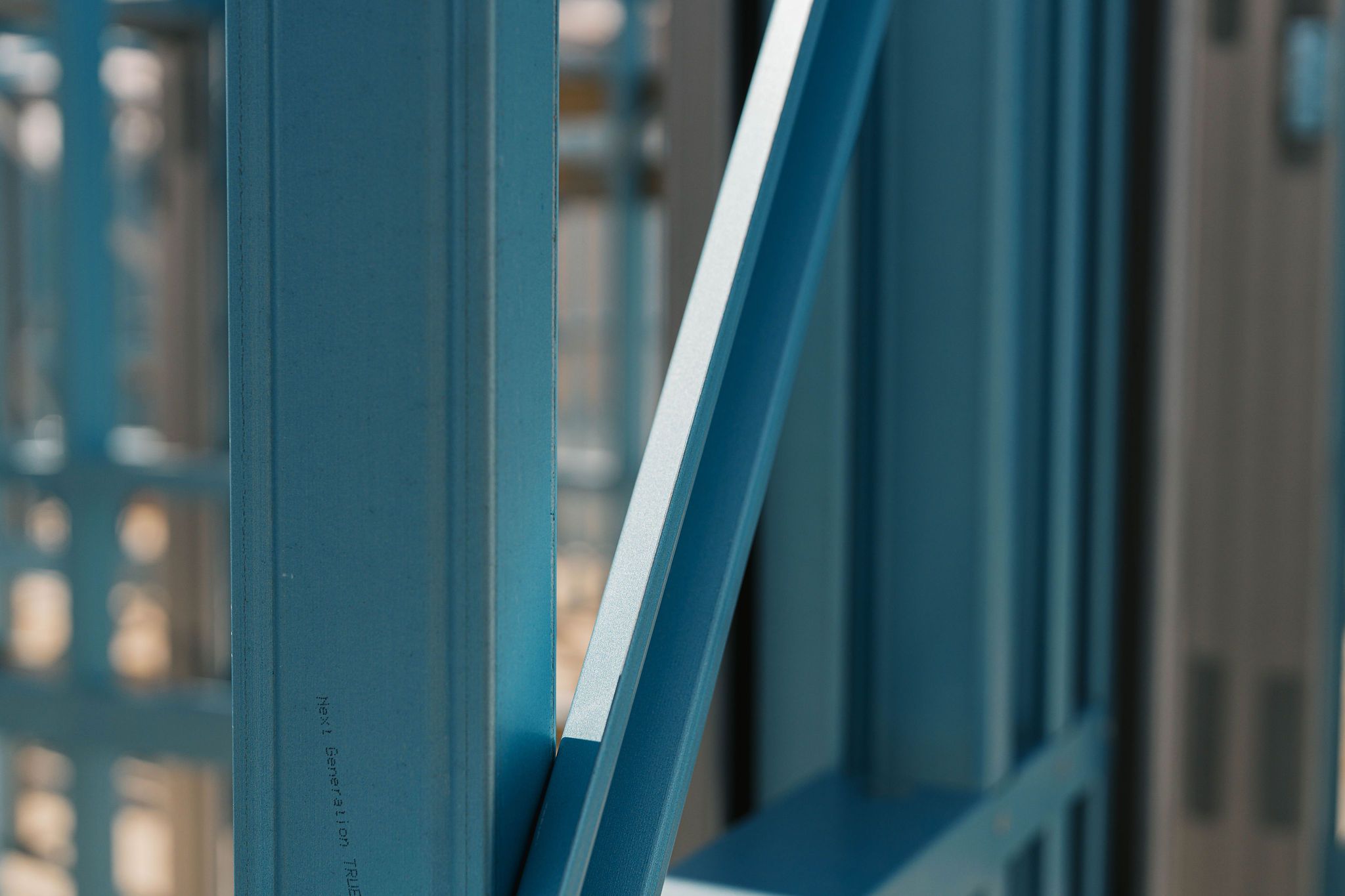 Close-up of blue steel framing for a house construction.