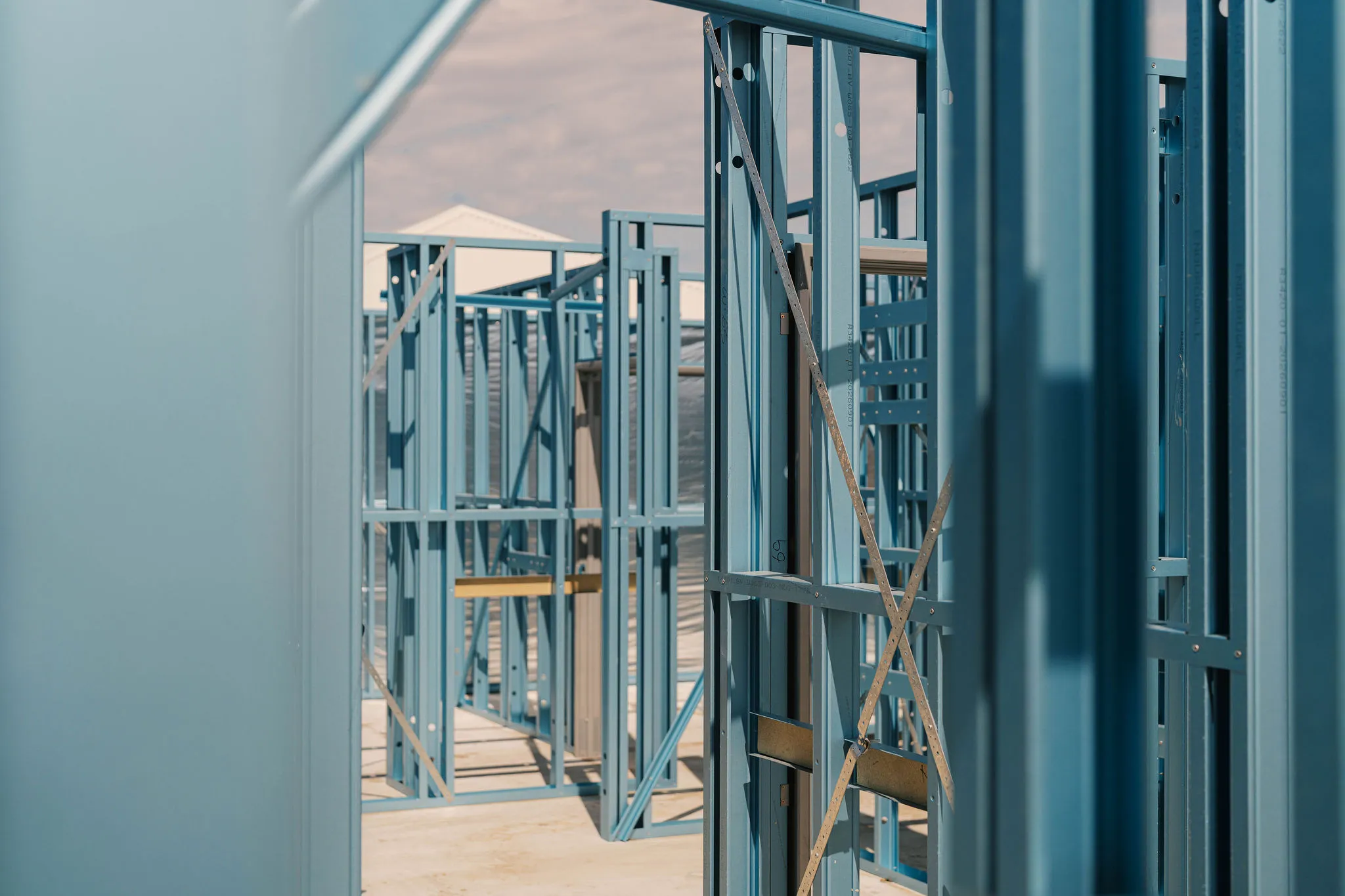 Light blue steel framing for a new home construction.