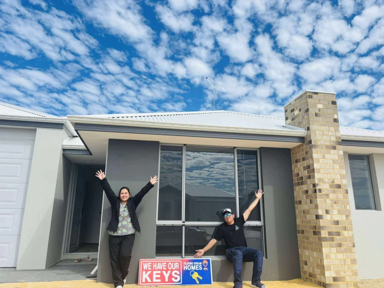 Couple celebrates receiving keys to their new home built by New Homes WA.